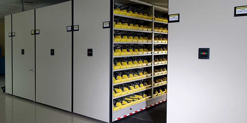 Military-gear-stored-on-weapon-shelves-on-powered-mobile
